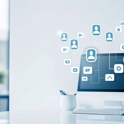 social media marketing concept, clean white minimalist desk with computer on it