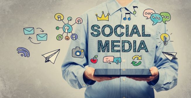 social media marketing concept drawn over man holding laptop