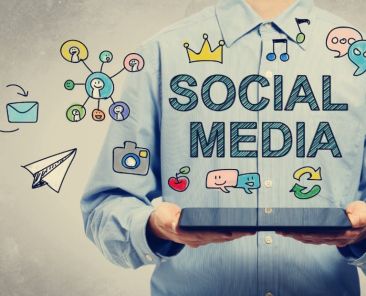 social media marketing concept drawn over man holding laptop
